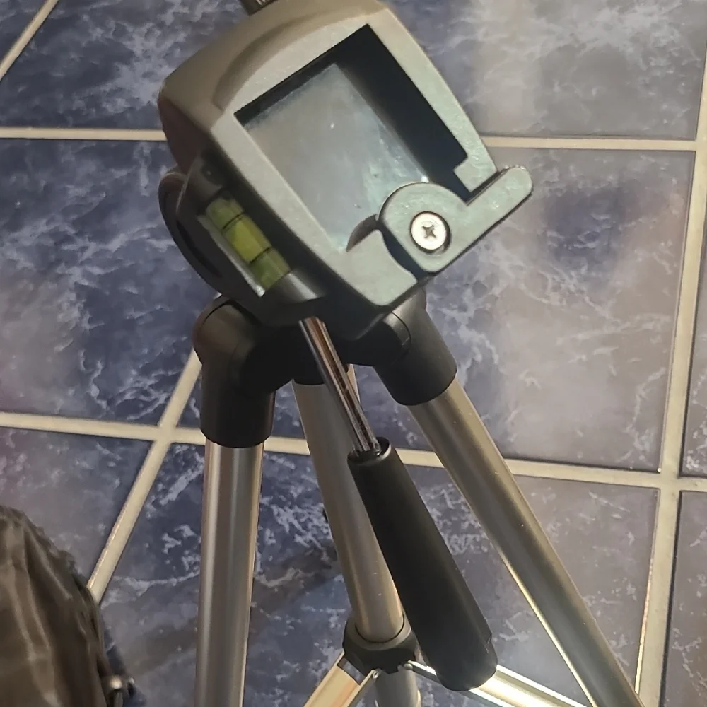 Versatile Black and Silver Camera Tripod